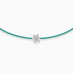 Emerald green string bracelet with a diamond flower